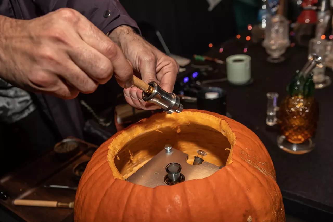 Woman packs pumpkin bong