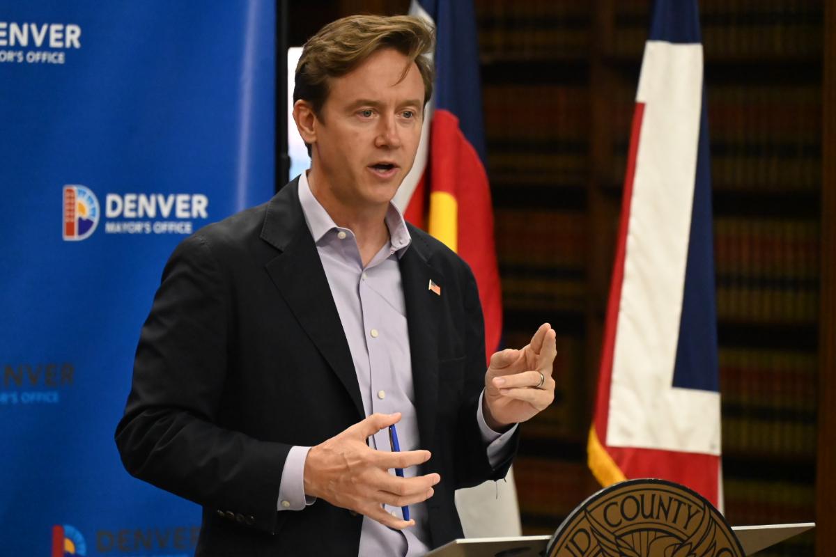 Mayor Mike Johnston talks to the press.