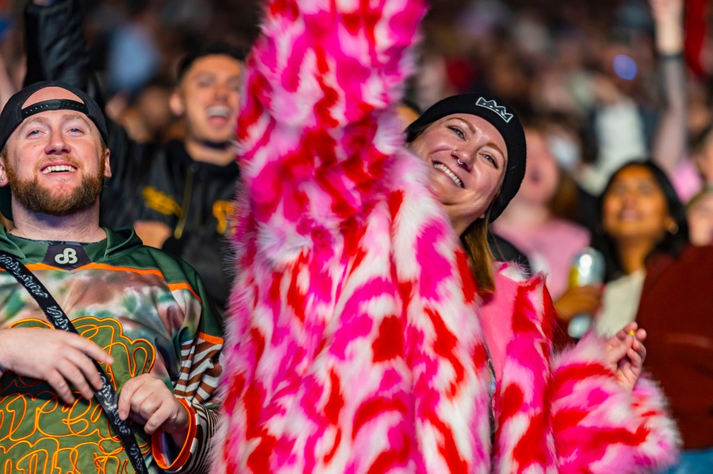 A photo showing a concertgoer at Red Rocks during T-Pain's performance.