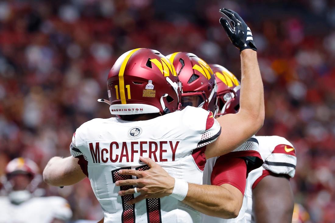 Luke McCaffrey #11 of the Washington Commanders celebrates a touchdown during the second quarter against the Atlanta Falcons at Mercedes-Benz Stadium on September 28, 2025 in Atlanta, Georgia.