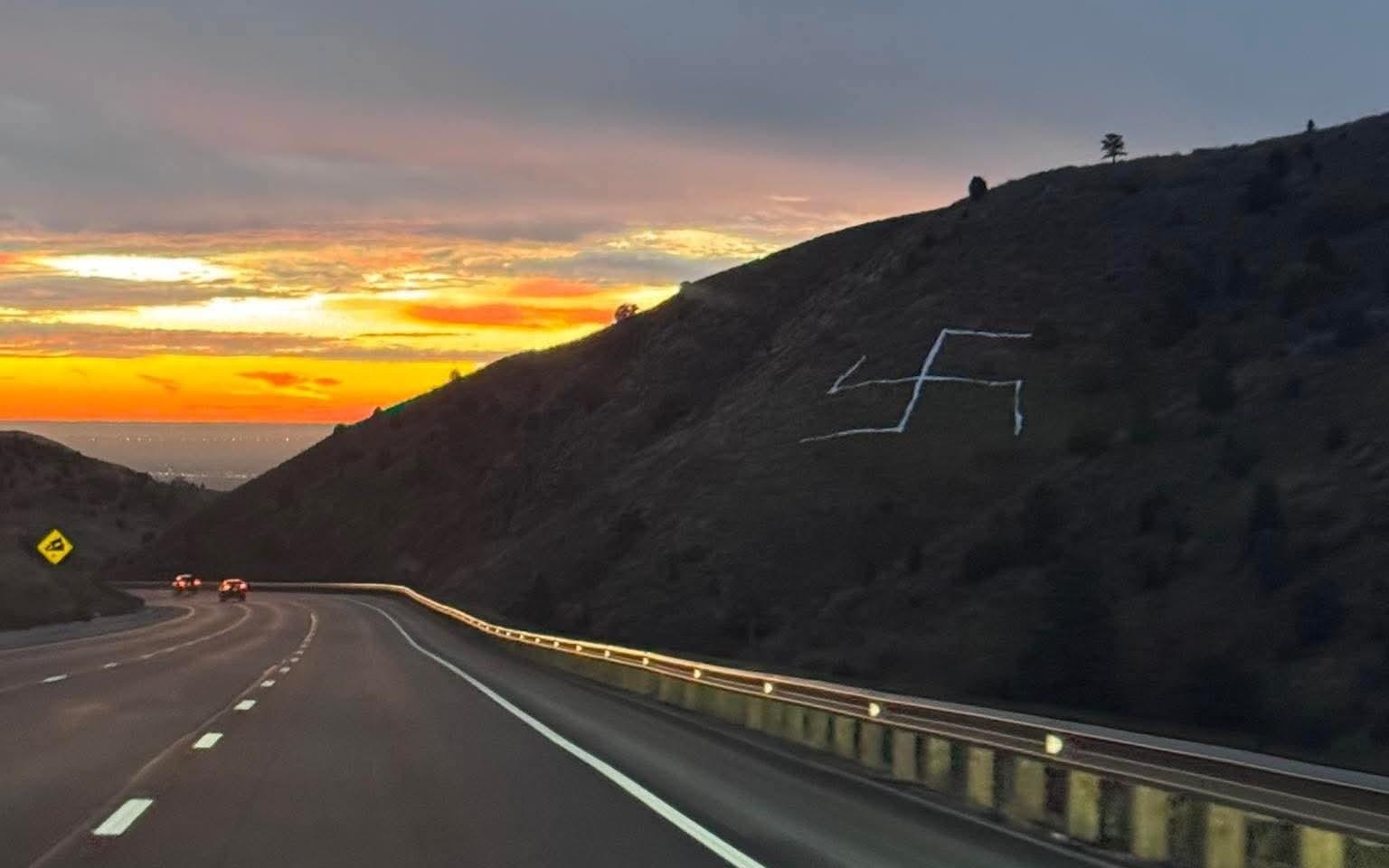 white swastika on hillside