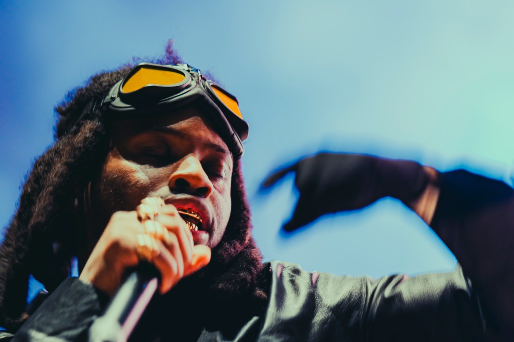 A photo showing Denzel Curry on stage at Red Rocks on October 31 for Halloween on the Rocks.