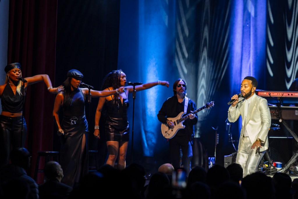 John Legend performing on stage at the Paramount Theatre on Wednesday, November 19.