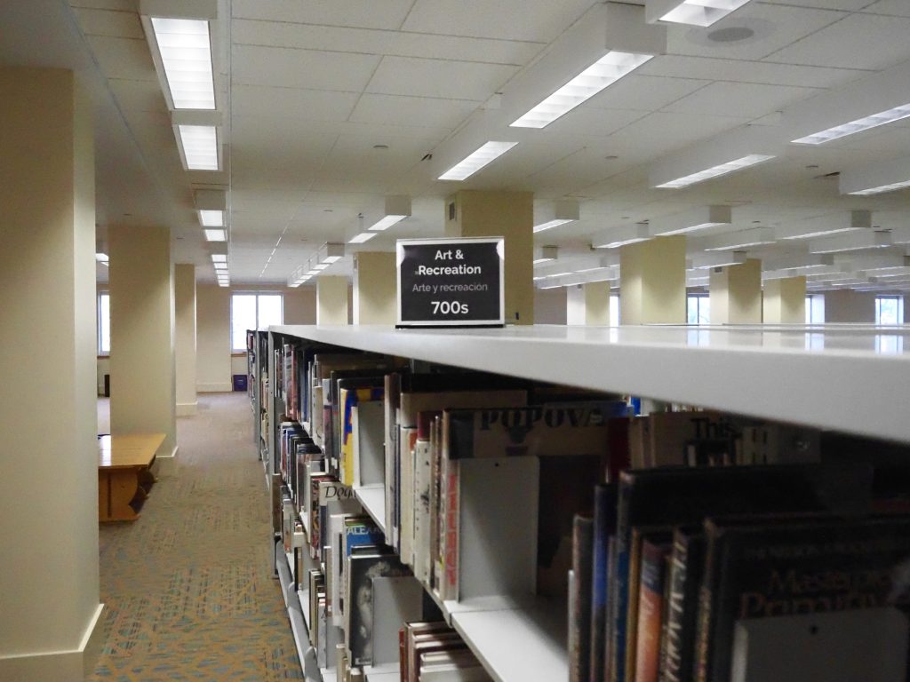 the arts & recreation section of books in a library