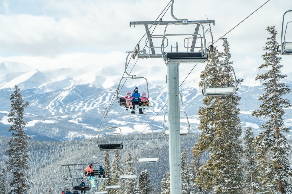 Snowboarders on a lift at Keystone Resort