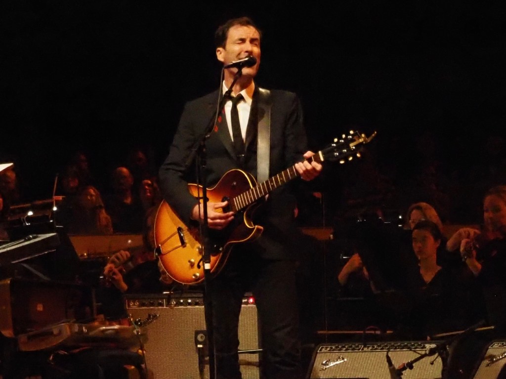 Andrew Bird performs with an orchestra