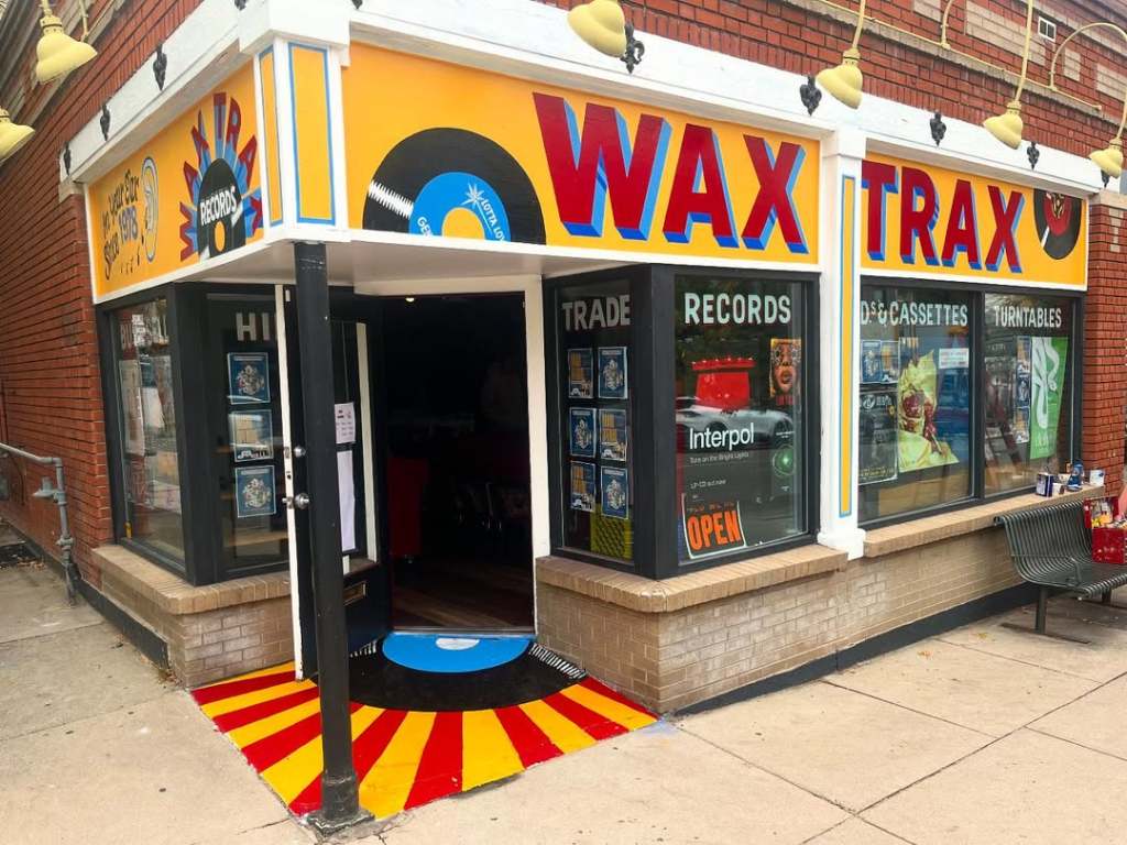The storefront sign bands and window signs at Wax Trax Records.