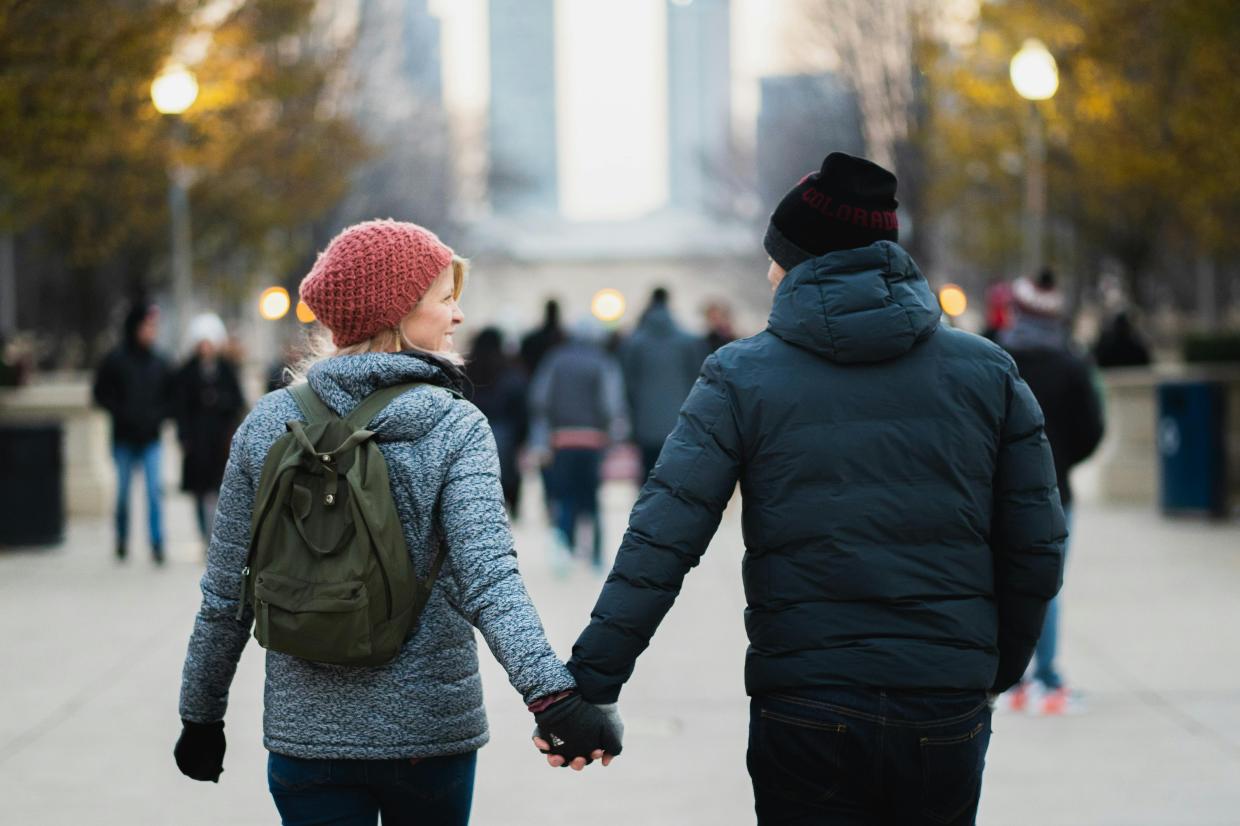 Two people holding hands