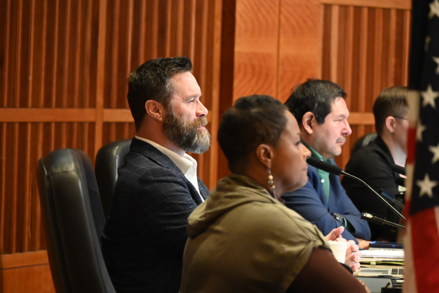 aurora city council sits during public meeting