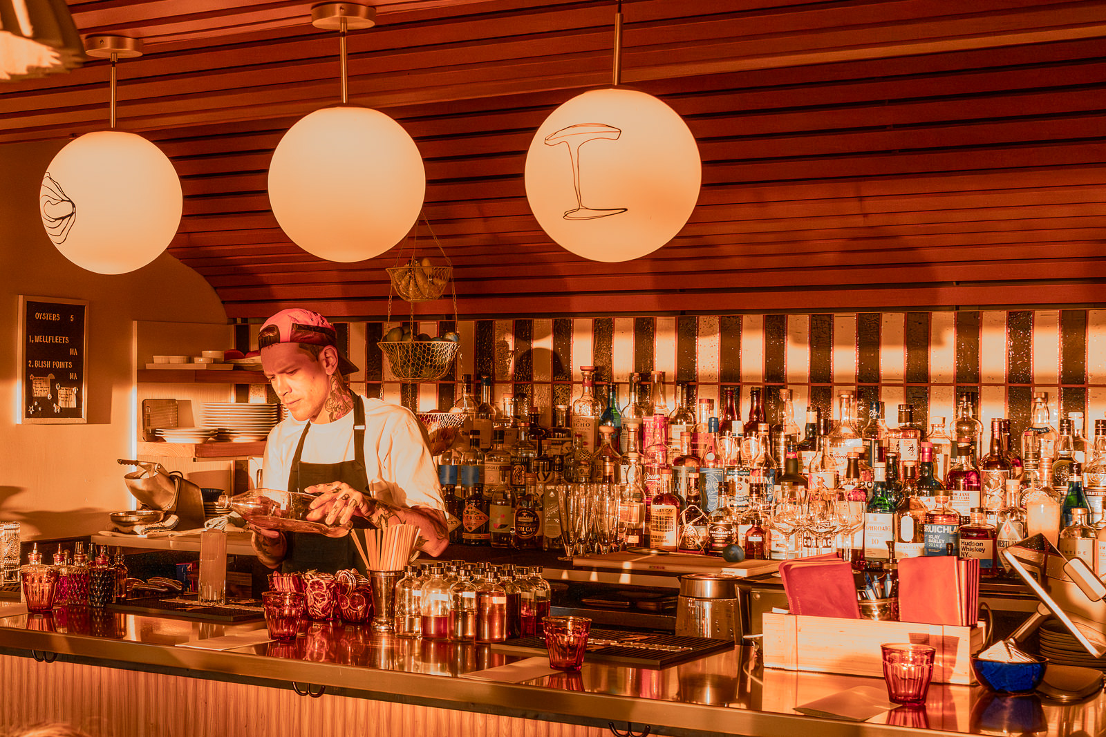 person working behind a bar