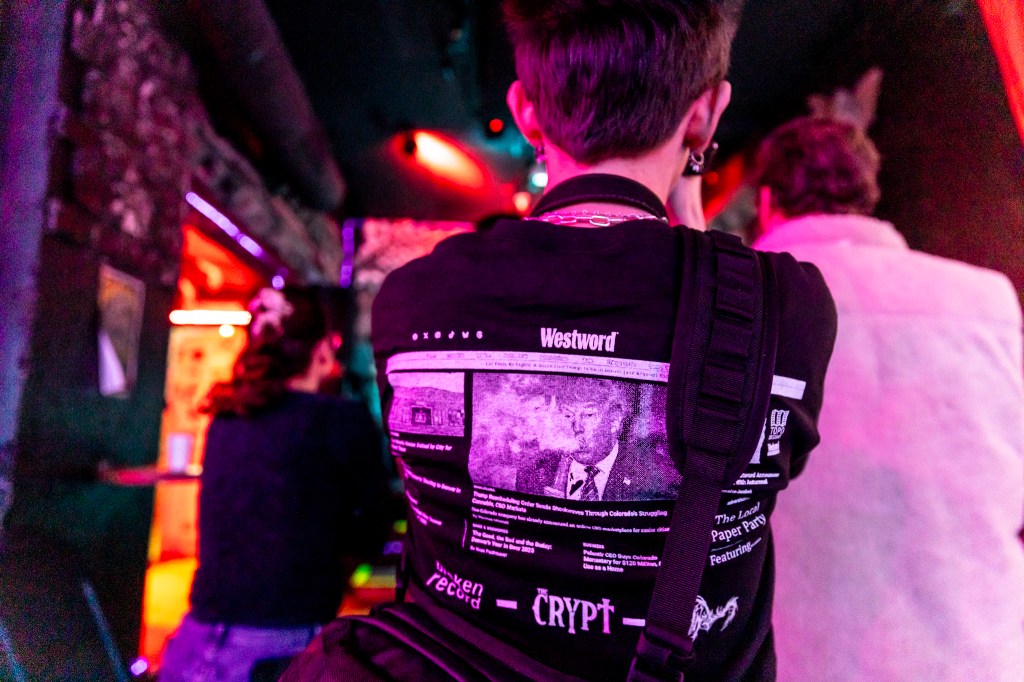 A fan wearing the collaboration t-shirt between Westword, Broken Record, The Crypt, and Insipidus.