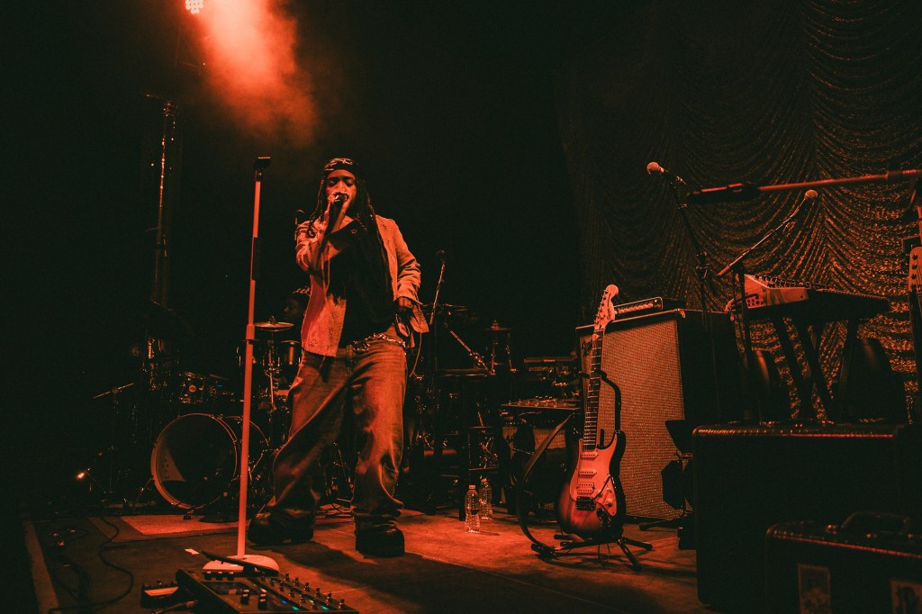Ambré on stage at the Summit Music Hall in Denver, Colorado.