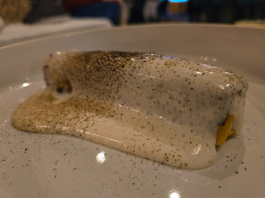 A blanket of Parmesan foam on a crispy chickpea fritter.