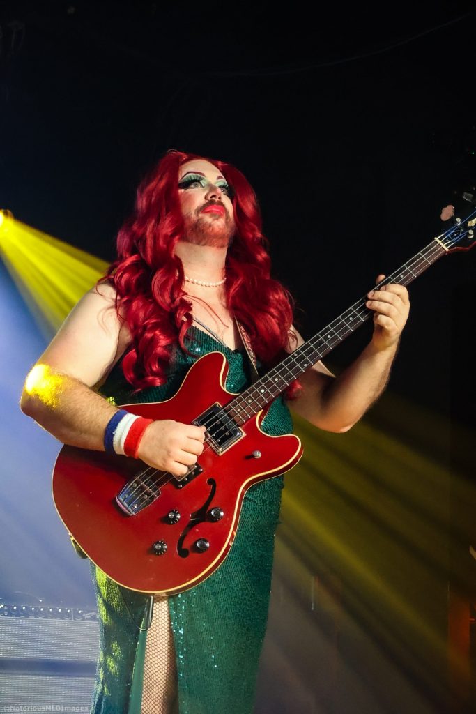 drag queen playing guitar