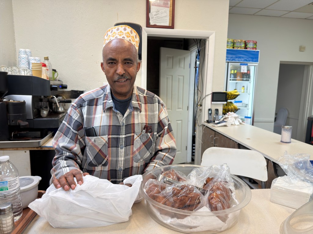 A man behind a counter