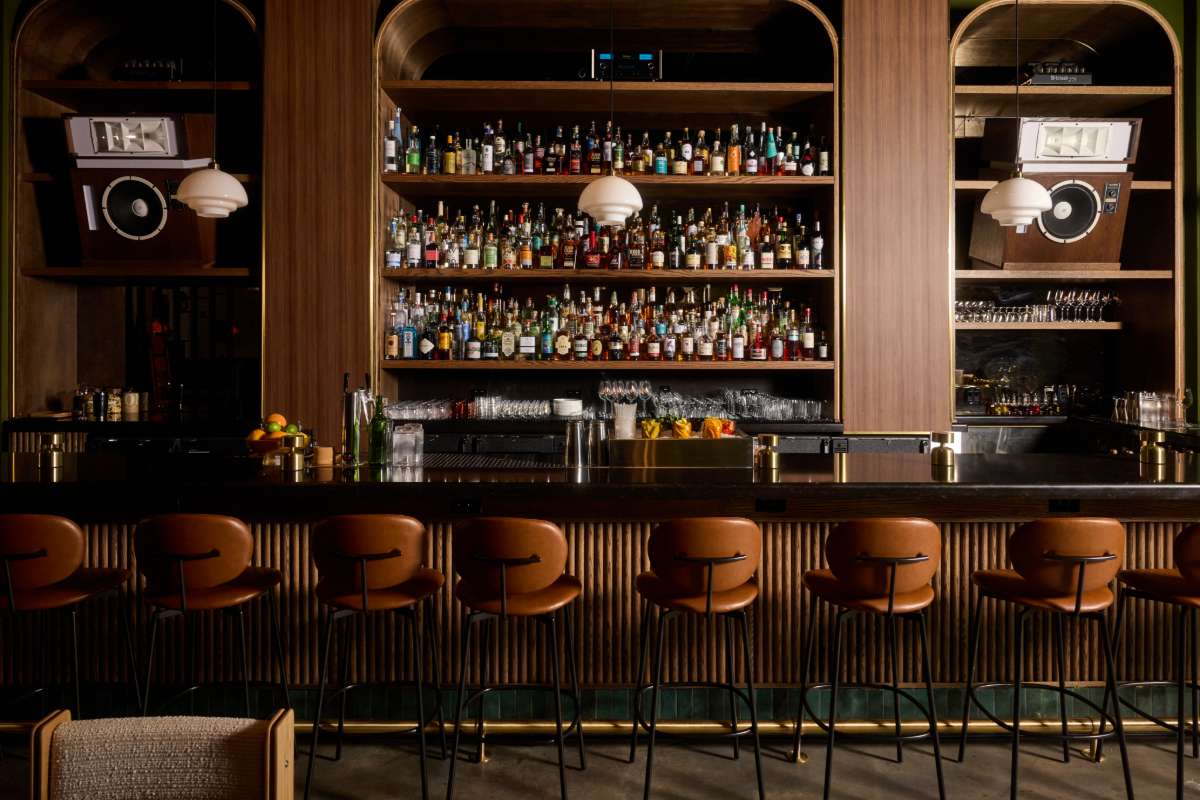 stools lined up in front of a bar