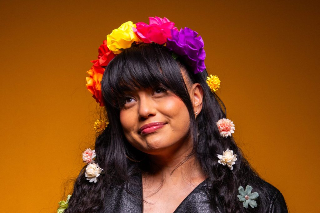 woman with a flower head dress on
