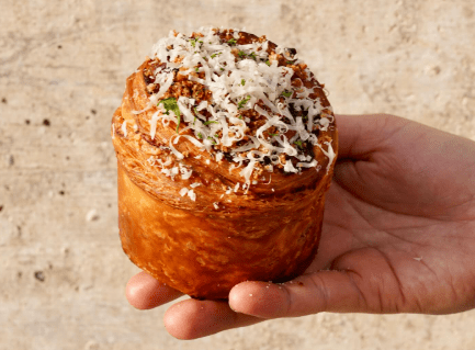 hand holding a pastry