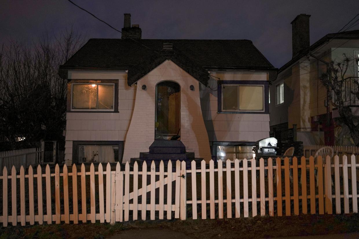 dark front yard and picket fence