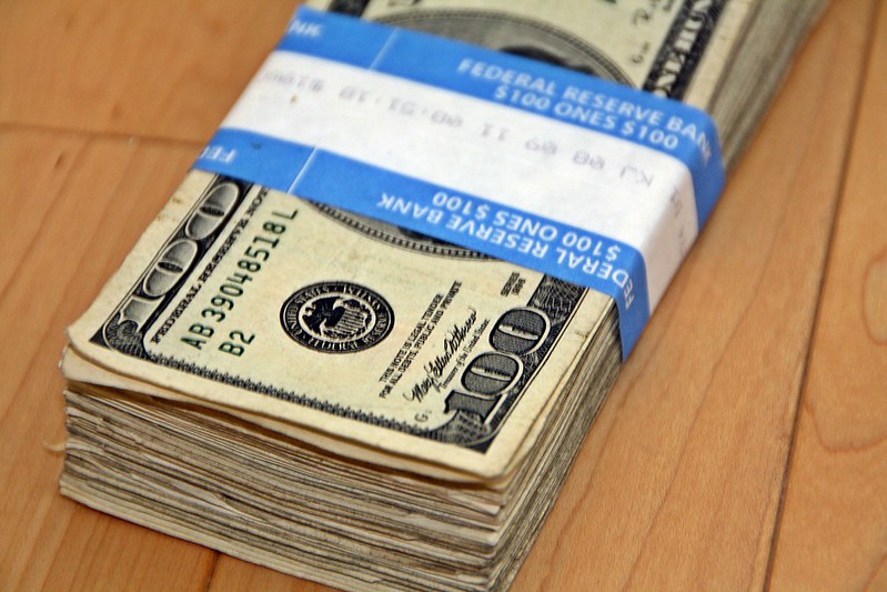 A wrapped stack of $100 bills
