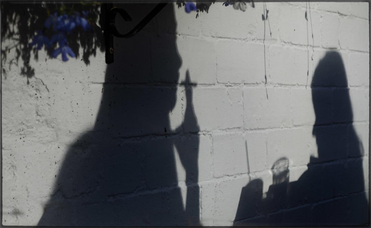 shadows of people drinking and smoking