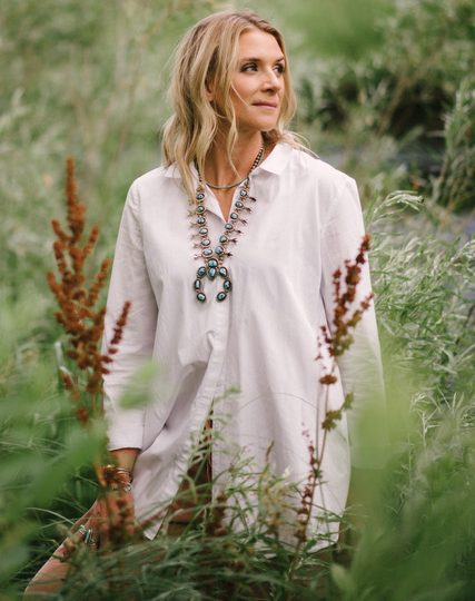 Woman stands in a field