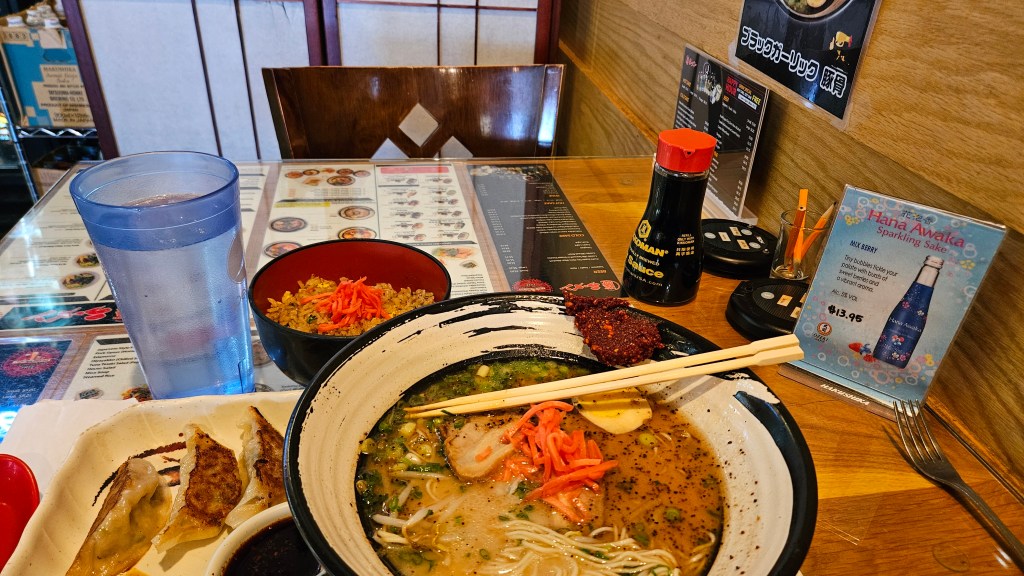 bowl of black garlic ramen on a table