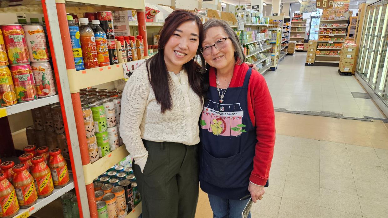 two women in an aisle of an Asian market