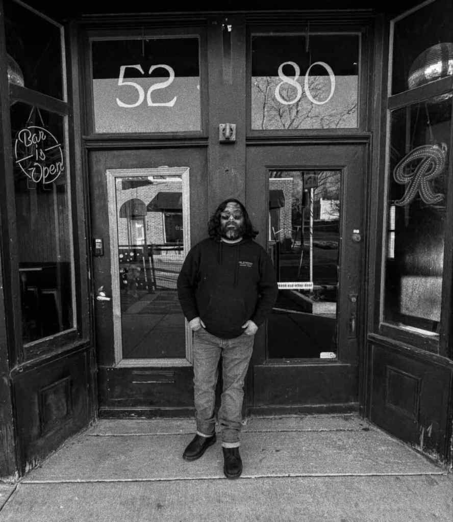 man standing in front of a doorway