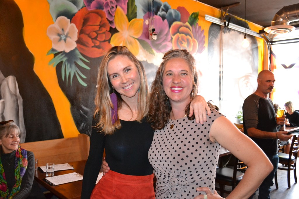 Two women stand together