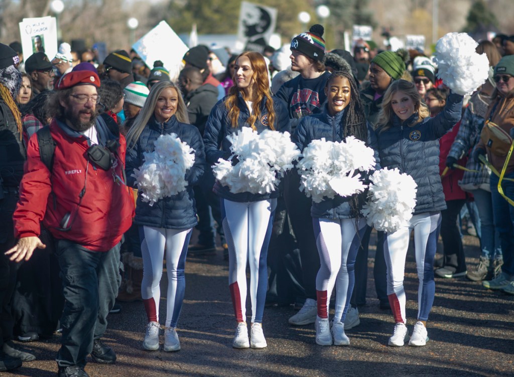 cheerleaders march in parade