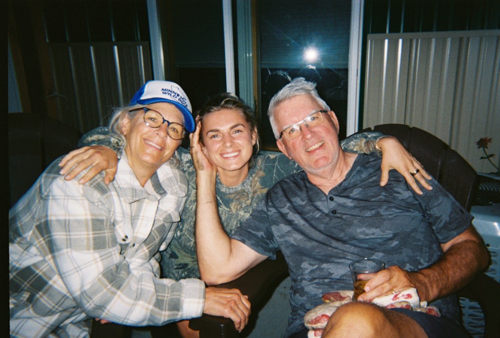 three people posing for a photo