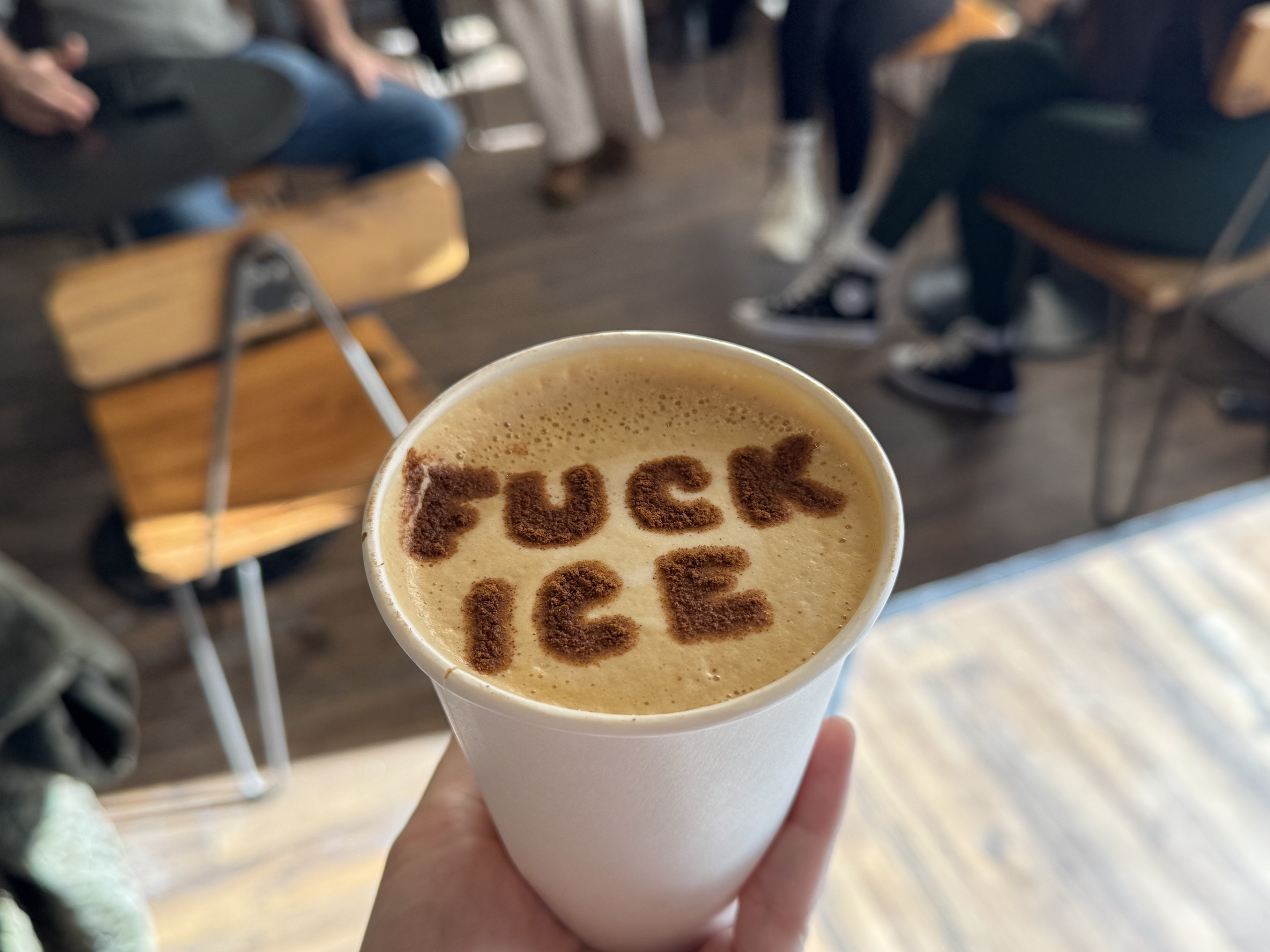 "fuck ice" on a latte