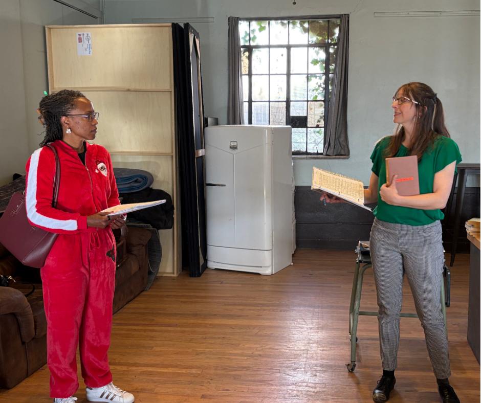 Two women rehearse a scene for a play