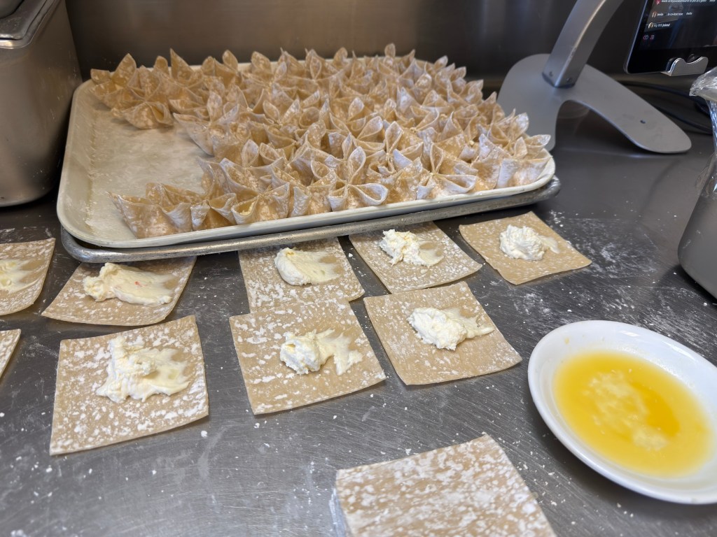 crab wontons in the process of wrapping