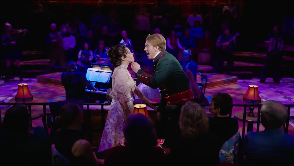 Two people act passionately in a theater production