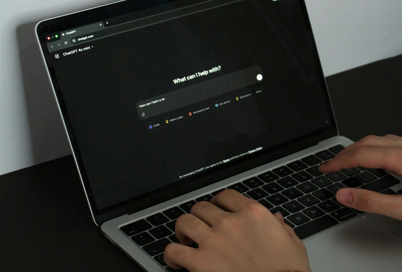 person using chatgpt on laptop