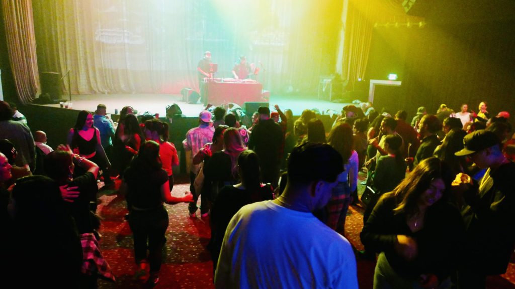 people dancing in a music venue