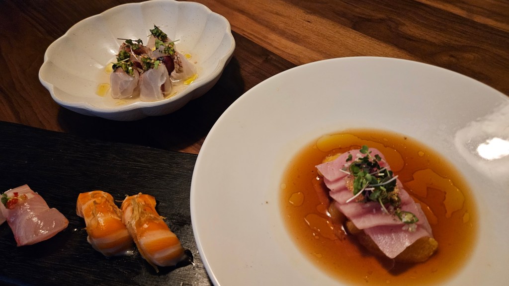 Sushi and sashimi with fruit at Uchiko