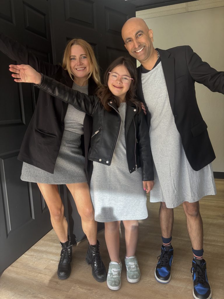 Three people pose together