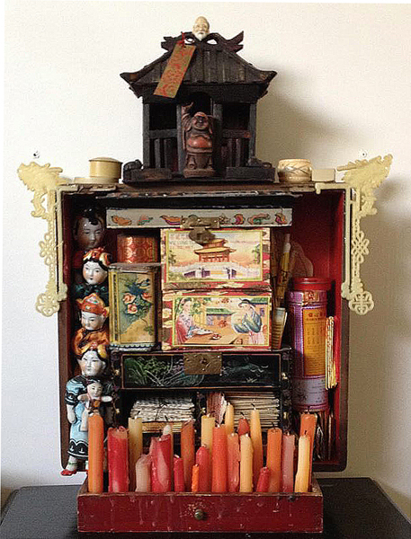 Artwork made of candles and other objects 