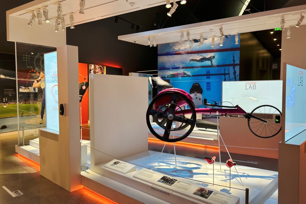 Amanda McGrory's racing wheelchair among other artifacts in the museum's Lab gallery