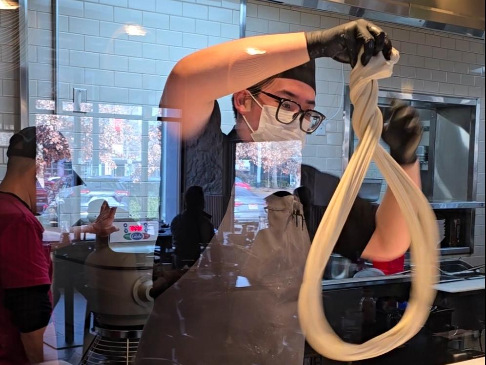 man making hand pulled noodles