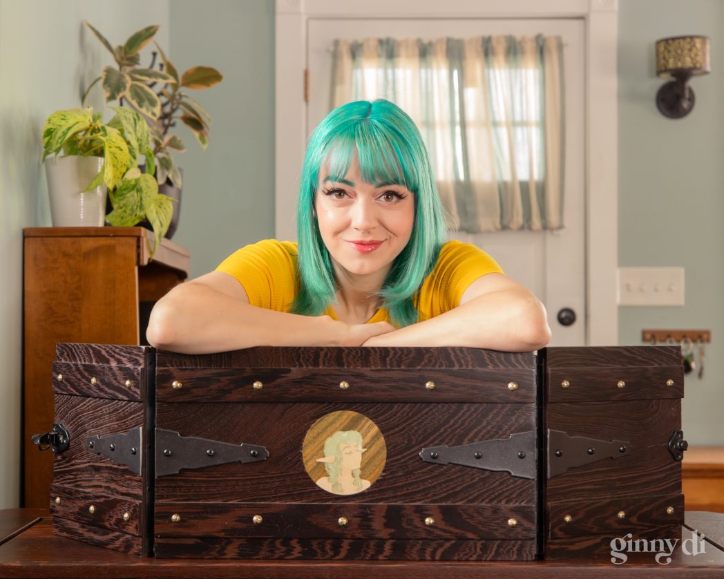 A portrait of a woman with teal hair