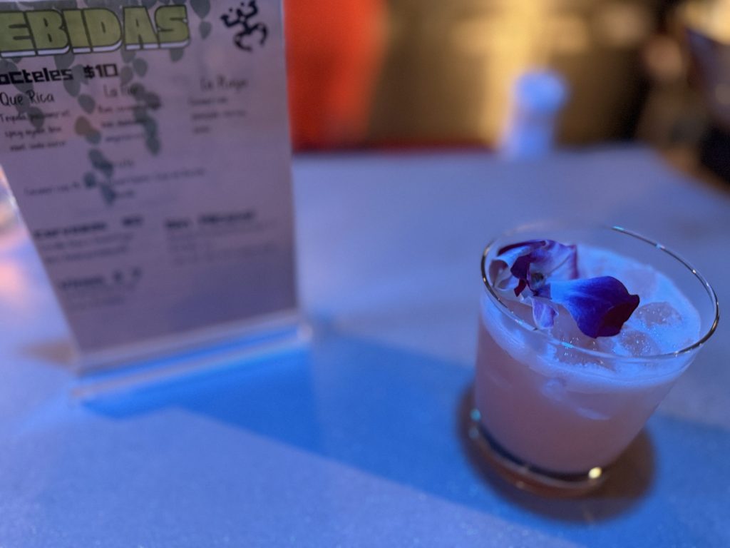 a cocktail with flower