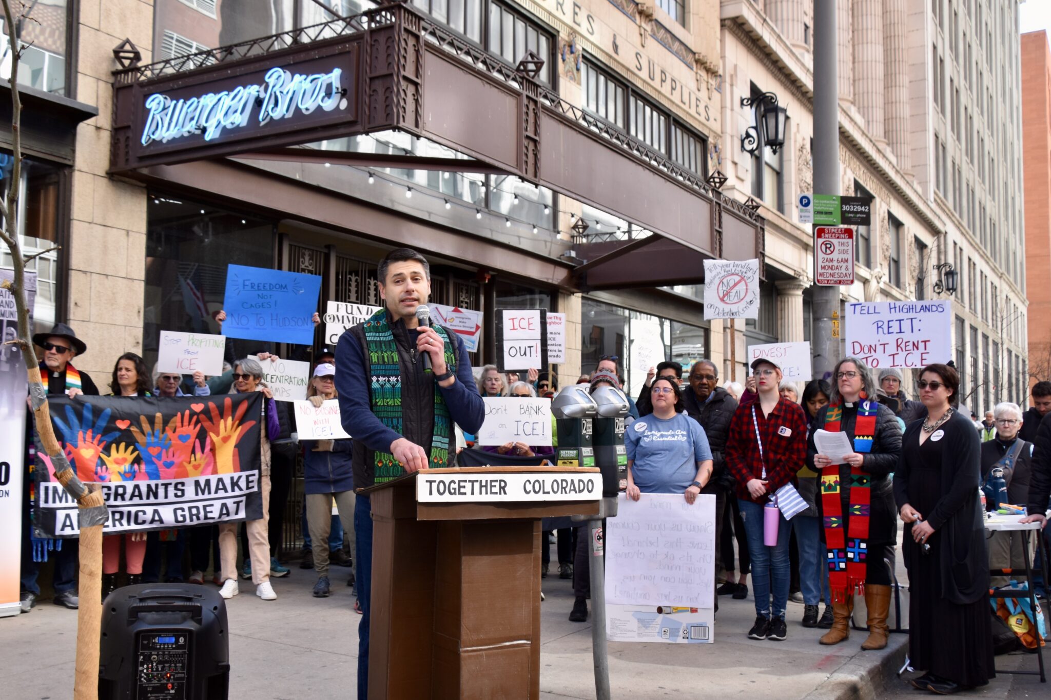 reverend speaks during denver protest
