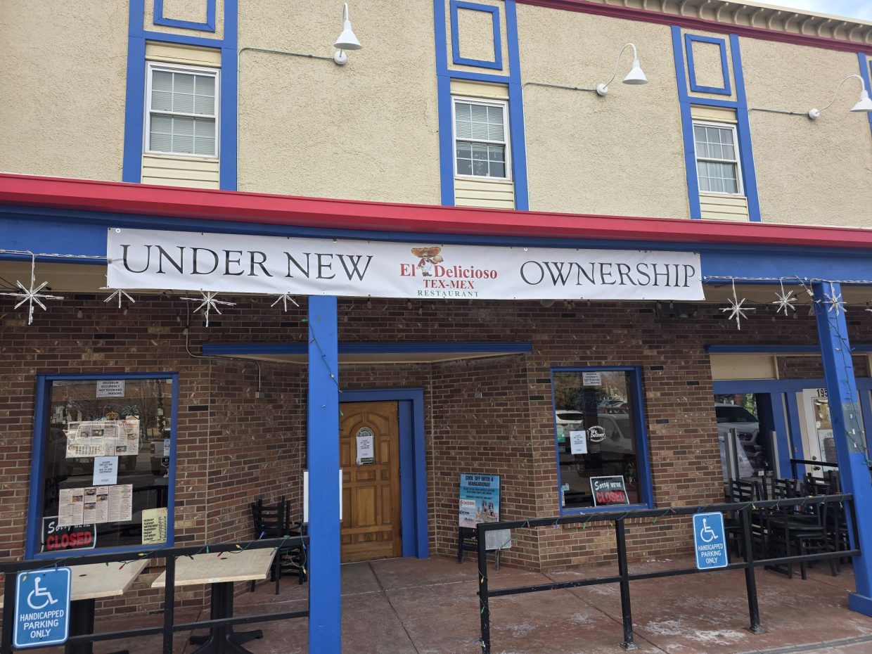 storefront with an "under new ownership" banner