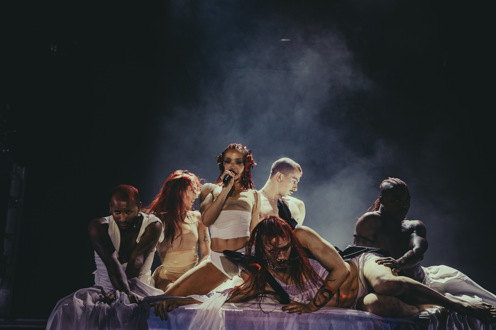 FKA Twigs on stage with additional stage performers at the Fillmore Auditorium in Denver, Colorado, on Monday, March 30.