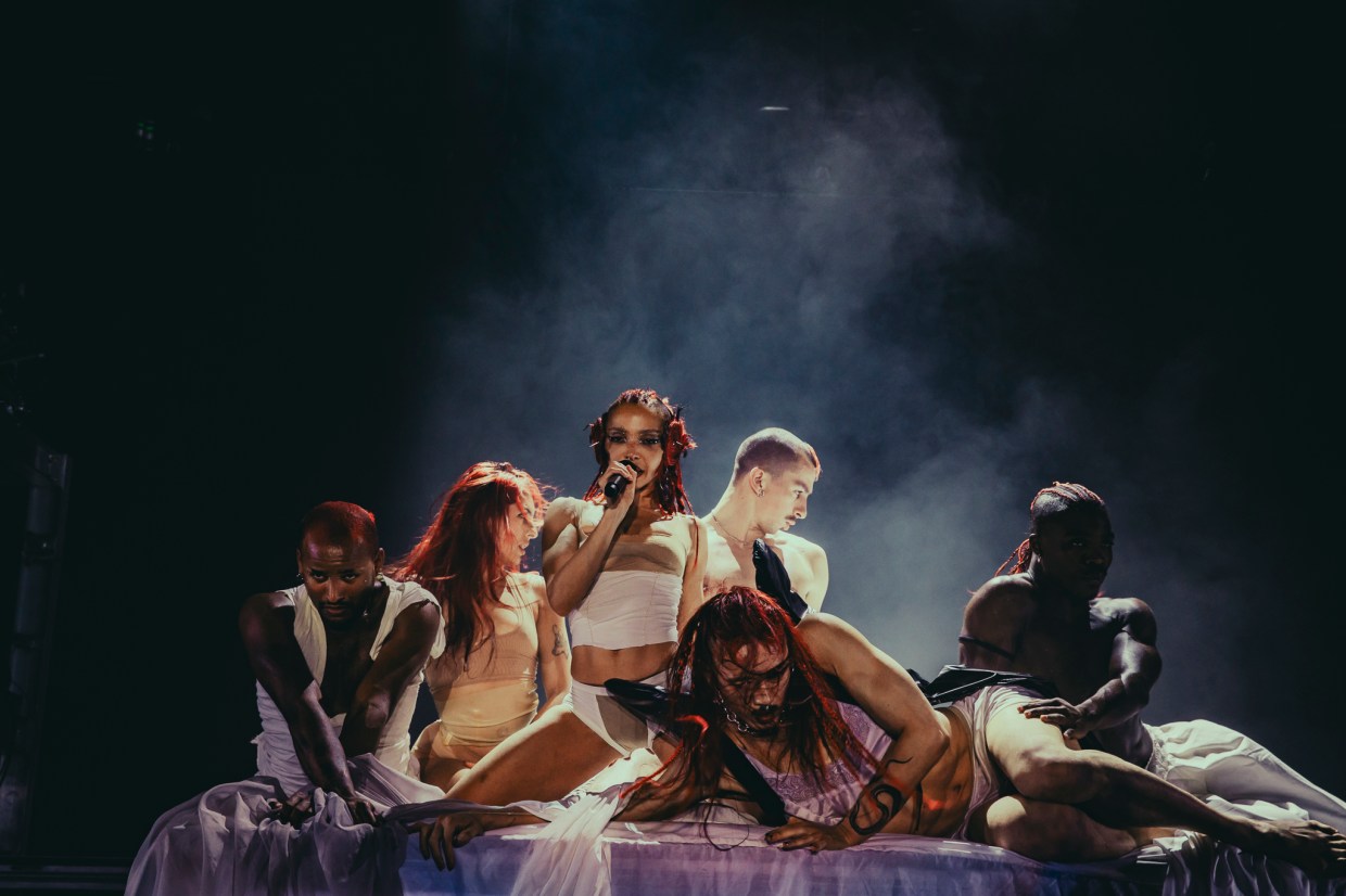 FKA Twigs on stage with additional stage performers at the Fillmore Auditorium in Denver, Colorado, on Monday, March 30.