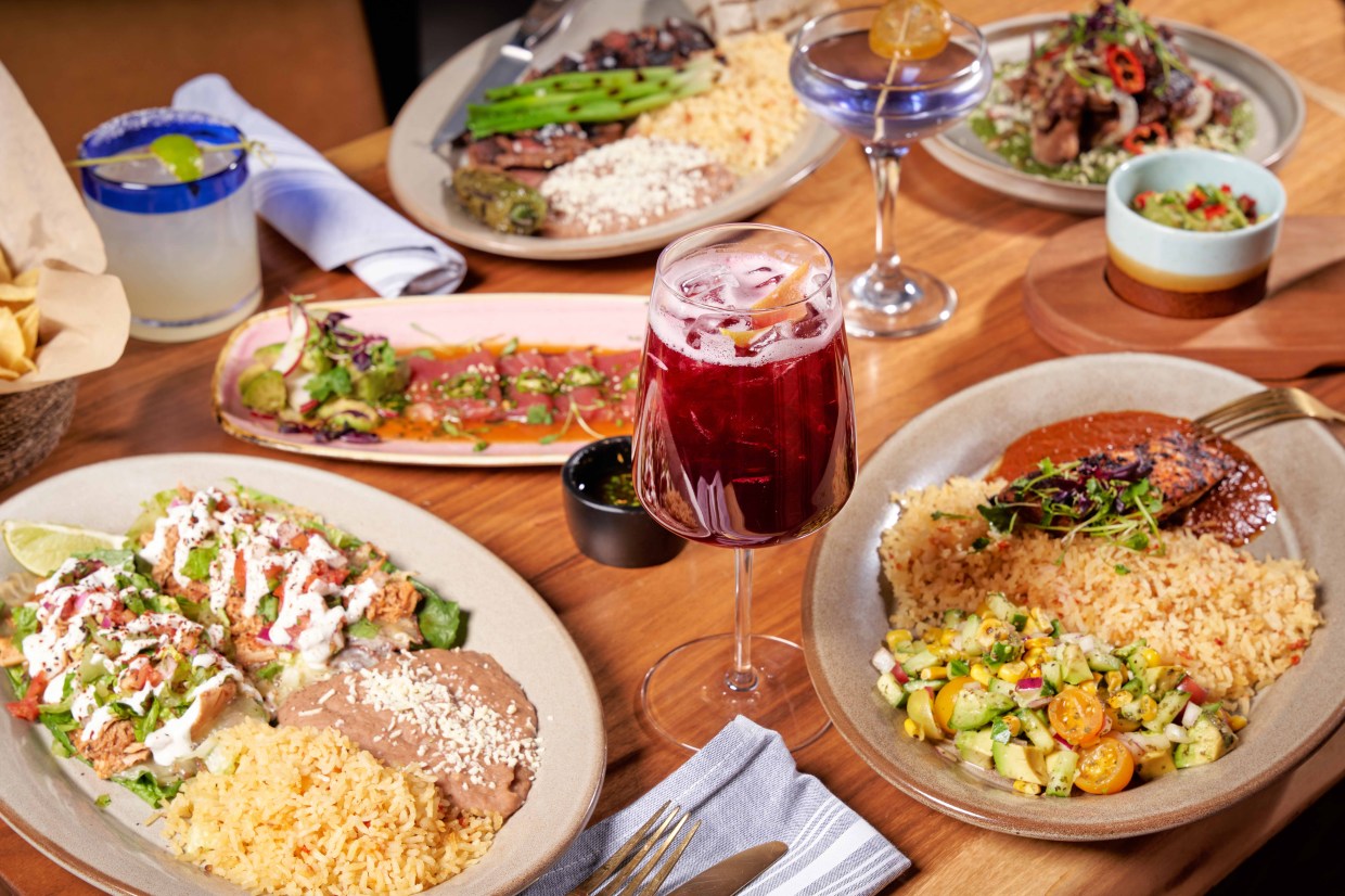 various mexican dishes and drinks on a table
